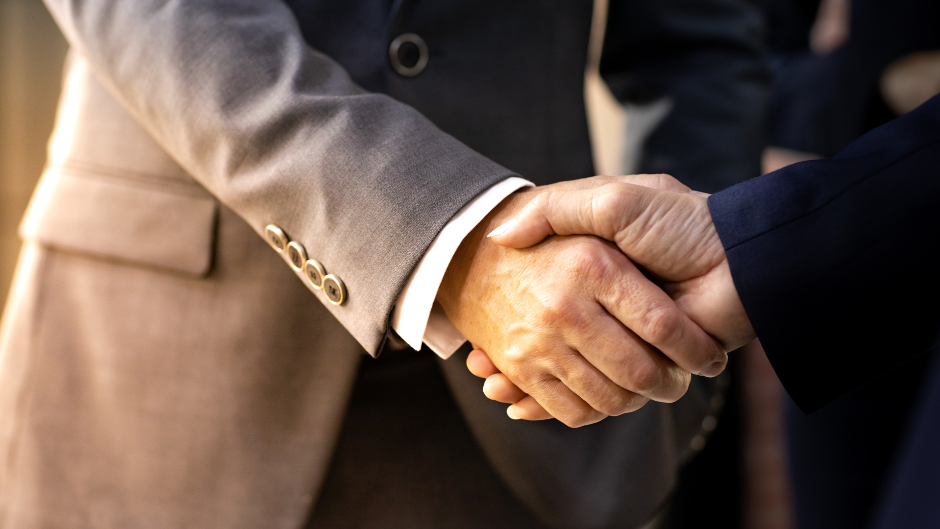 Two puzzle pieces coming together, symbolizing the successful leveraging of synergies in M&A
