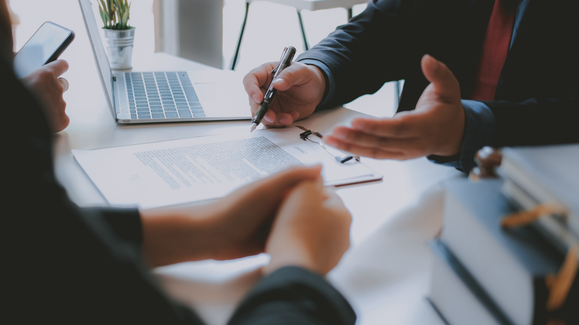 Meritus Group business broker consulting with a client to maximize the value of their business sale