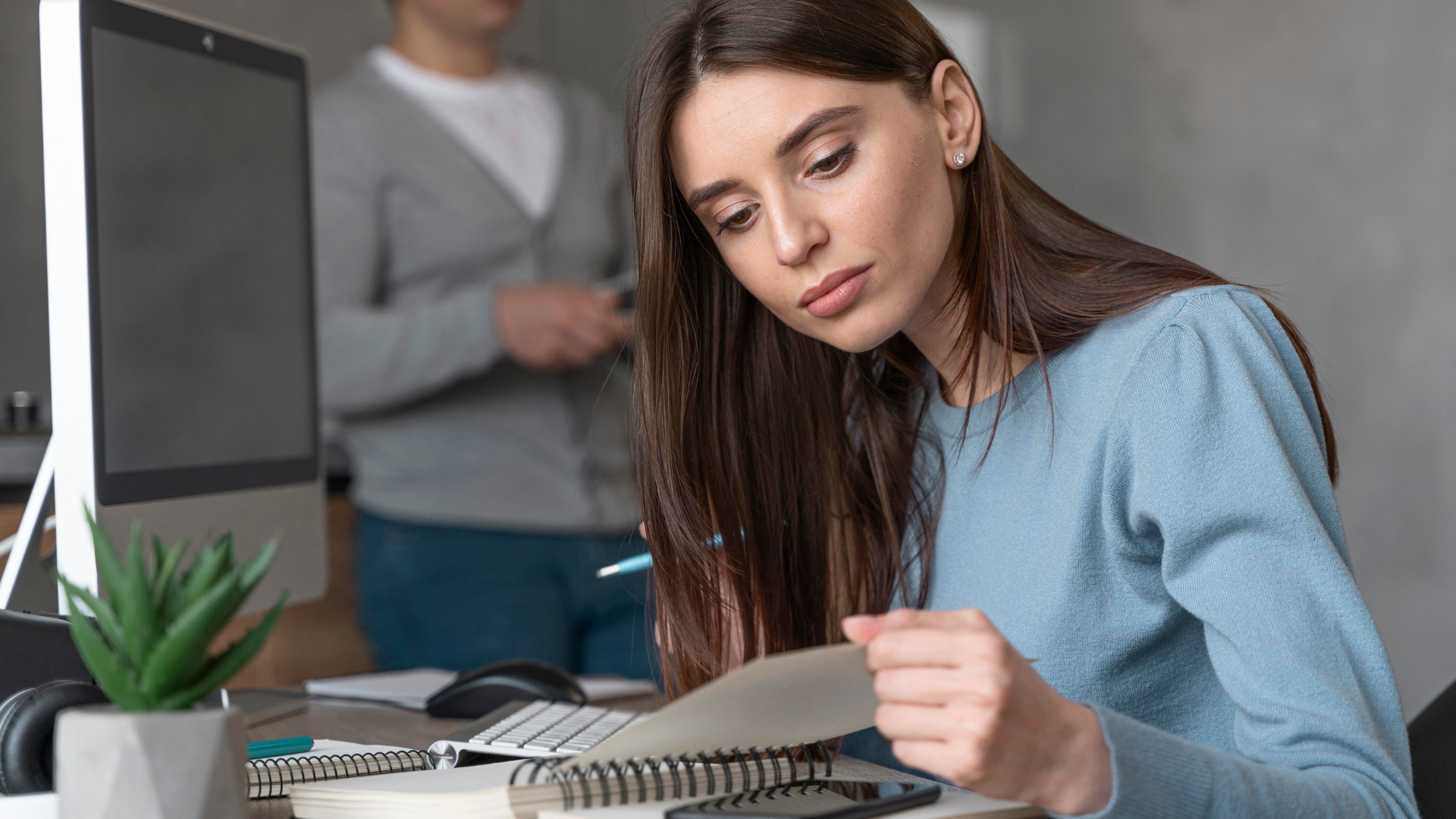 Entrepreneur reviewing financial documents for acquiring a cash-flowing small business to build an empire.