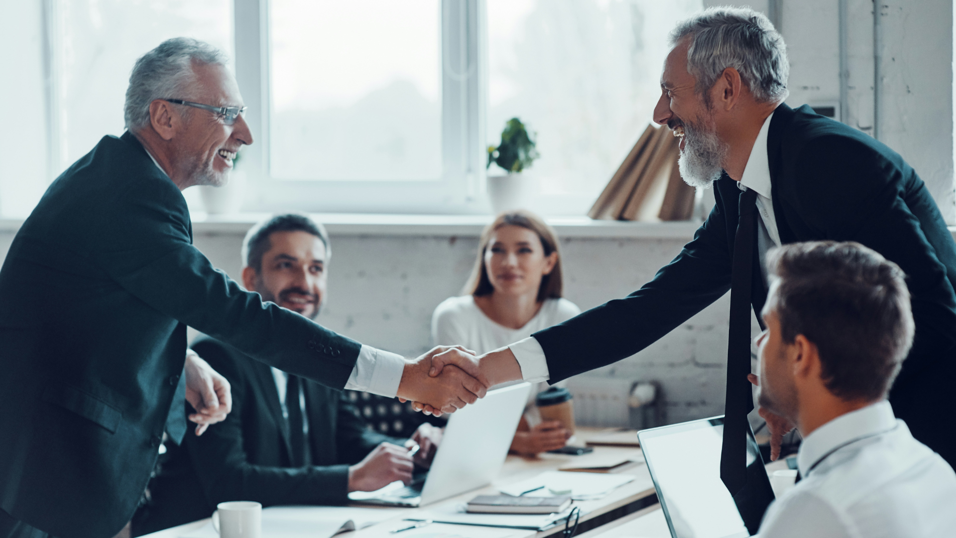 A business owner signing an NDA to ensure confidentiality during a business sale.
